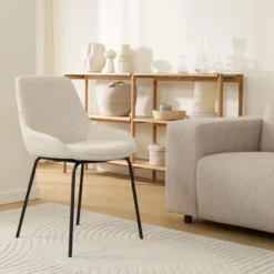 Eetkamerstoel Nora-Isa bouclé beige - zwart onderstel
