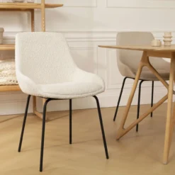 Eetkamerstoel Nora-Isa bouclé beige - zwart onderstel