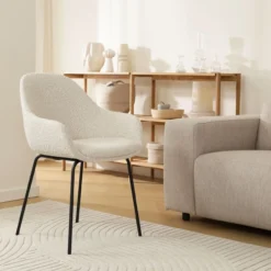 Eetkamerstoel Nora-Mae bouclé beige - zwart onderstel