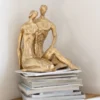 Koppel zittend goud