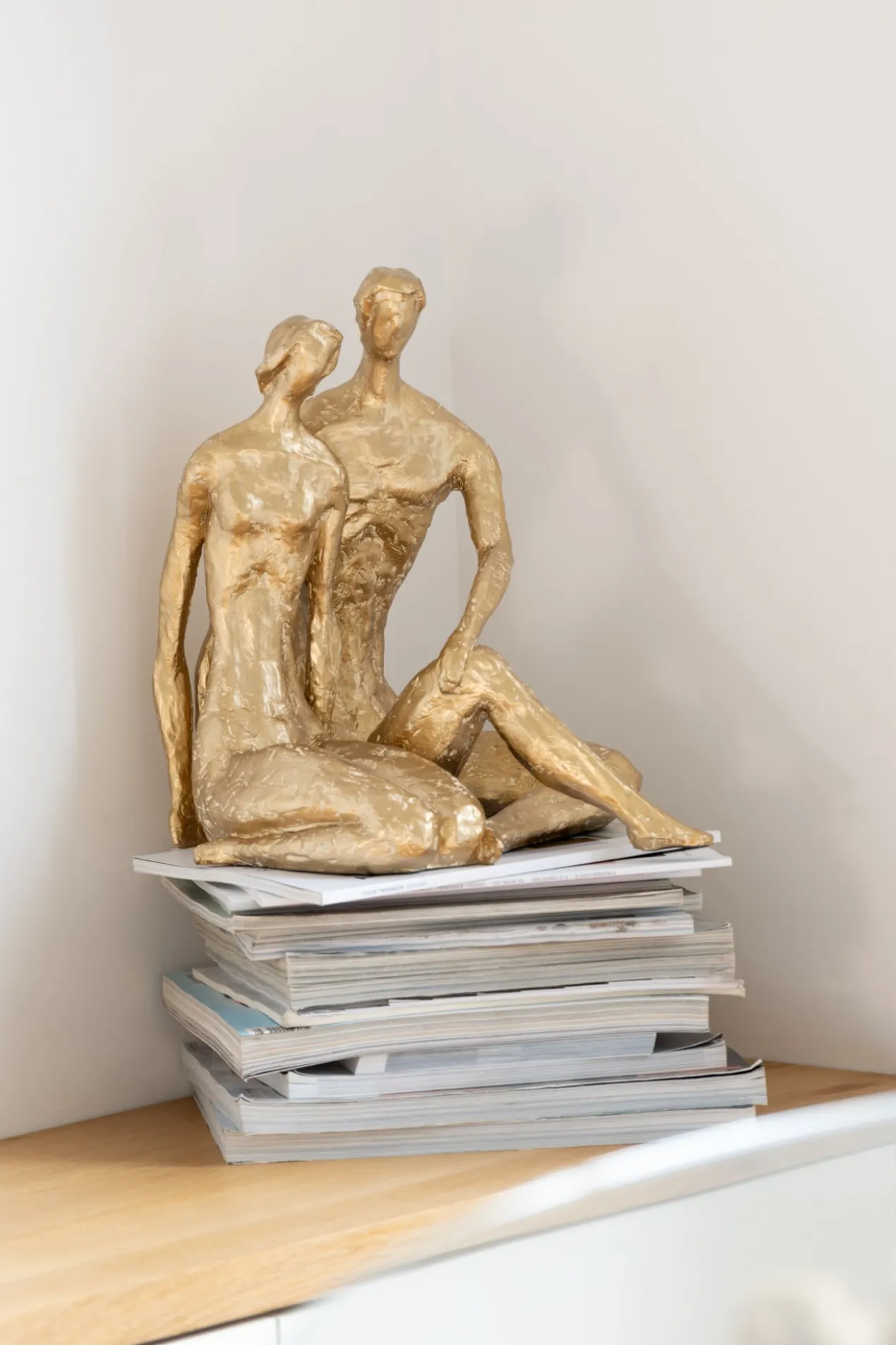Koppel zittend goud