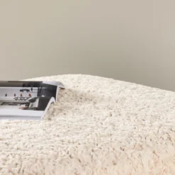 Vierkante schapenvacht poef Erla Beige